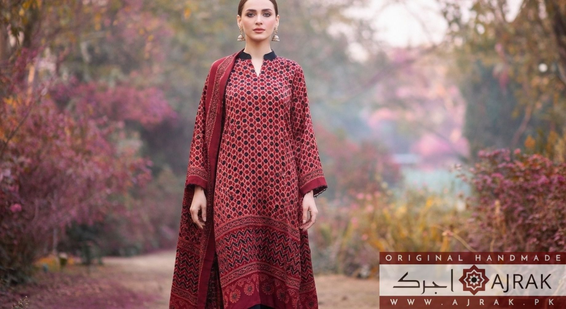 Full-length view of Gulzar maroon silk Ajrak suit in natural outdoor light
