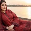 a deep red handcrafted Ajrak silk suit adorned with circular block motifs